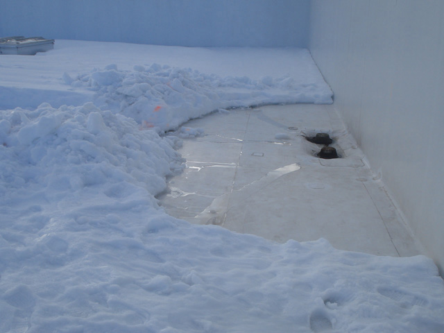 Clearing Ice from rooftop drains