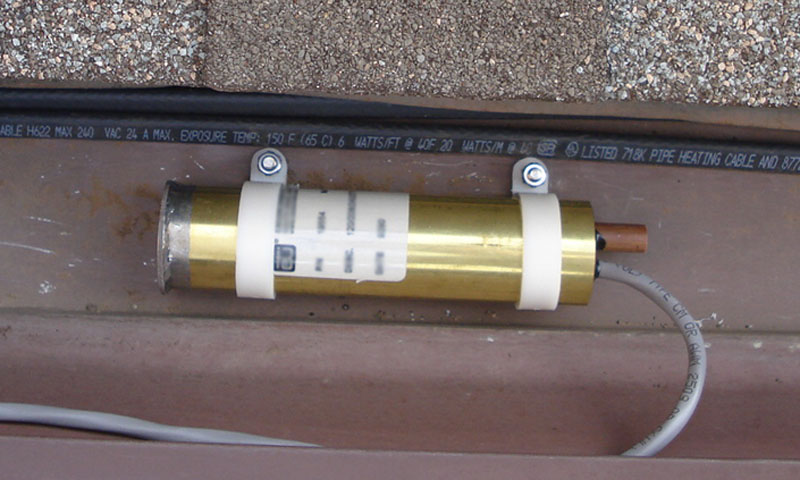 gutter mounted moisture/temperature sensing controller