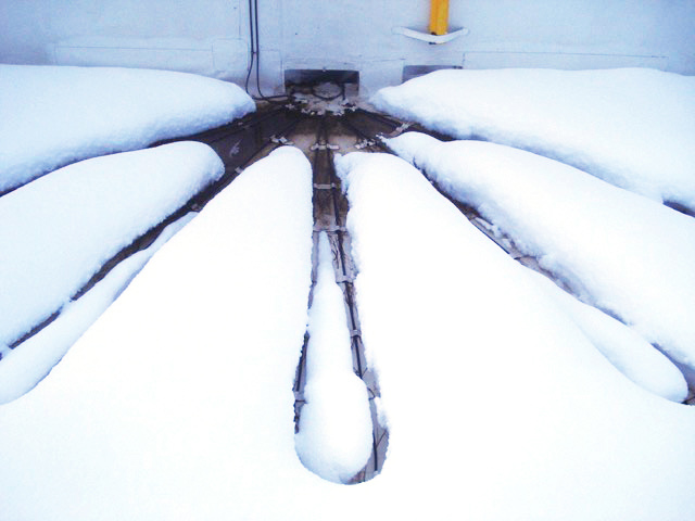 Heat tape melting snow on a commercial roof in Flagstaff AZ