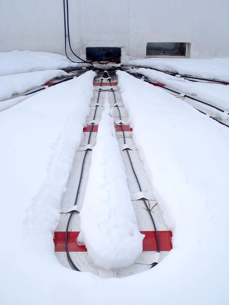 Commercial heat cable melting snow on a roof in flagstaff
